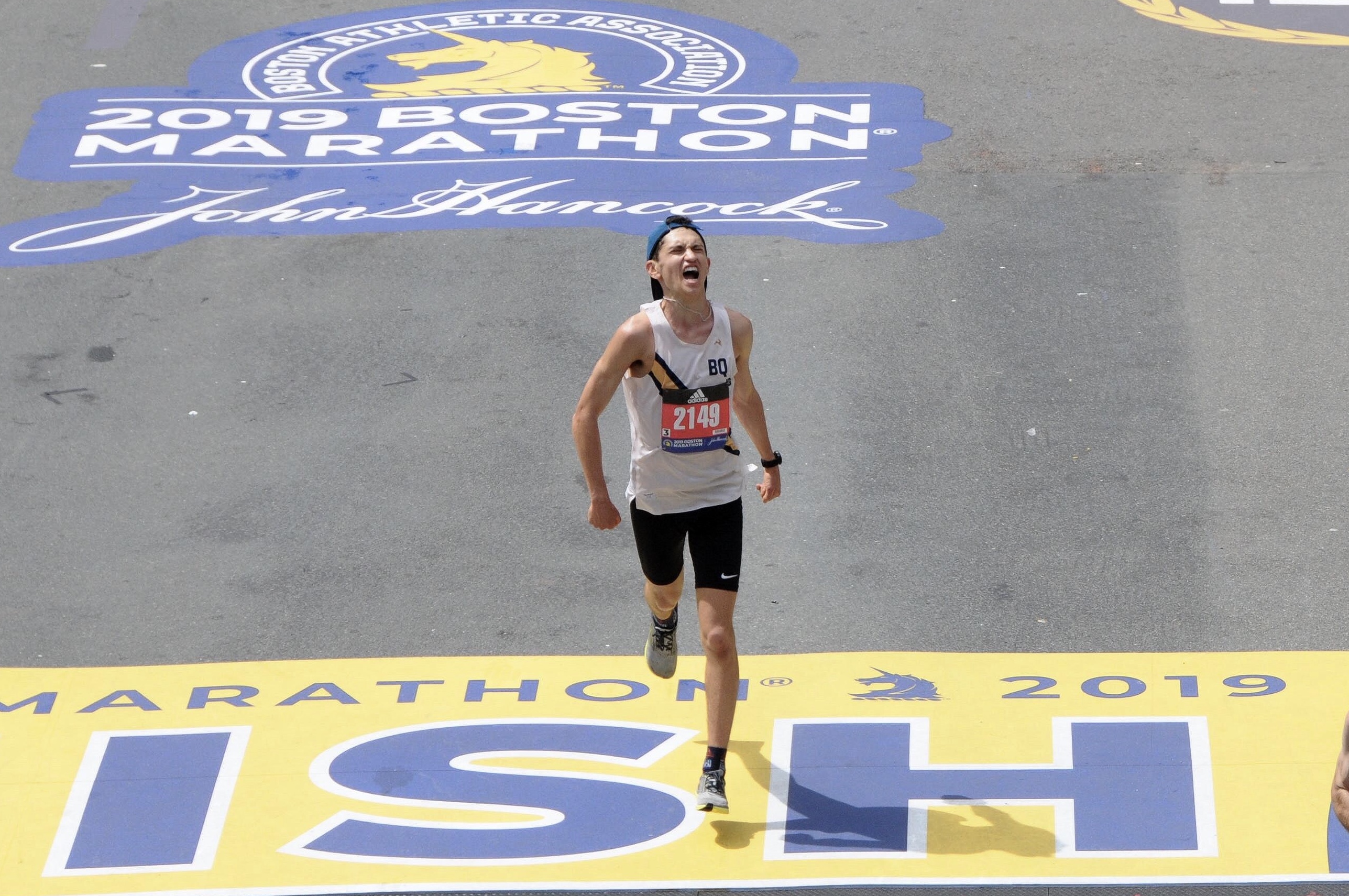 Crossing the finish line at the 2019 Boston Marathon